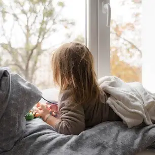 Child looking out an Earthwise window